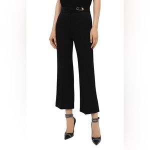 Versace black trousers with a golden pin